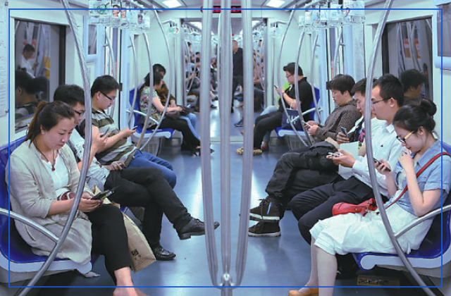 people using mobile in metro shanghai